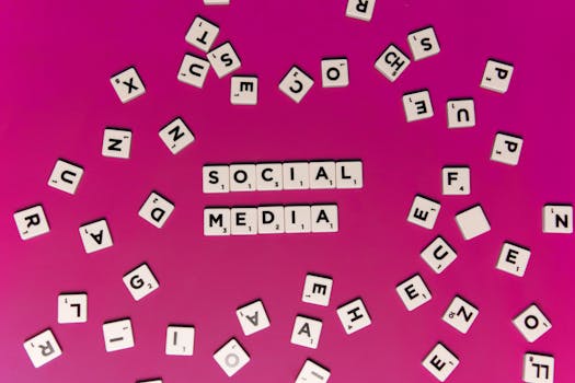 Alphabet tiles forming 'Social Media' on a vibrant pink background, perfect for digital marketing themes.